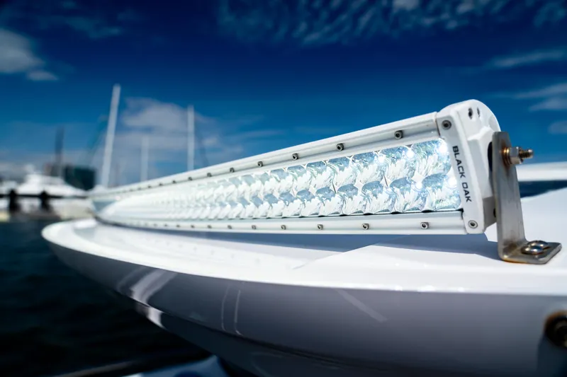 Slide: The Image of Close-up of a Black Oak light bar on a 2022 Axopar XC Aft Cabin boat. - 10