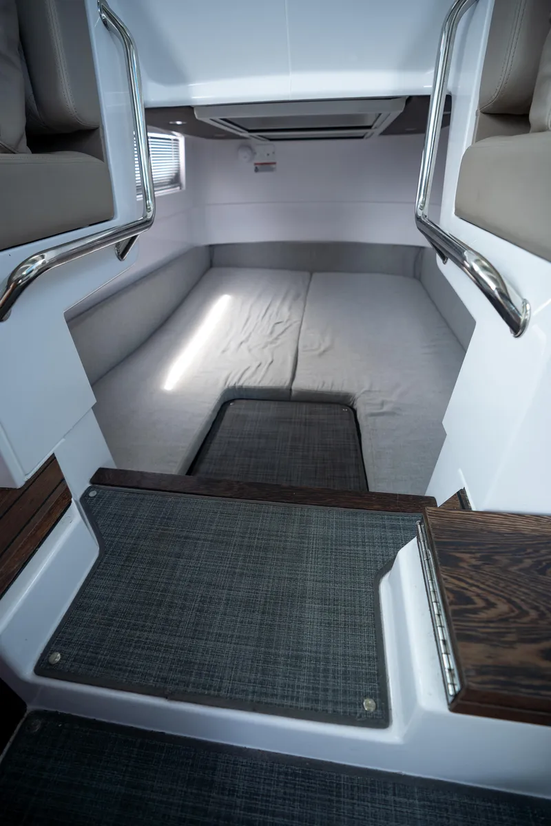Slide: The Image of 2022 Axopar XC Aft Cabin interior with cozy sleeping area and modern design. - 18