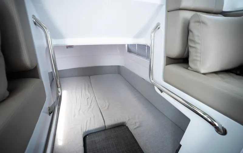 Slide: The Image of 2022 Axopar XC Aft Cabin interior with comfortable seating and modern design. - 19