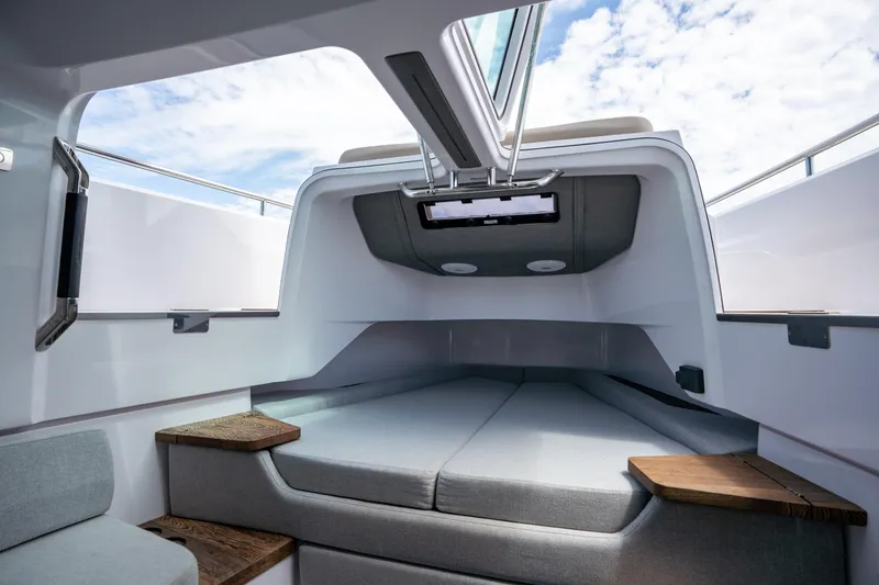 Slide: The Image of 2022 Axopar XC Aft Cabin interior with modern design and skylight. - 27