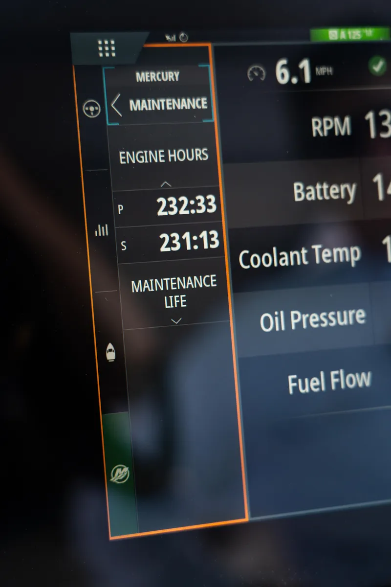 Slide: The Image of 2022 Axopar XC Aft Cabin dashboard displaying engine hours and maintenance details. - 7