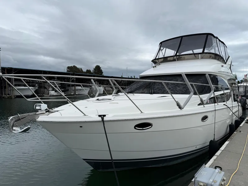 Slide: The Image of 2006 Meridian 391 Sedan yacht docked at marina under cloudy sky. - 1