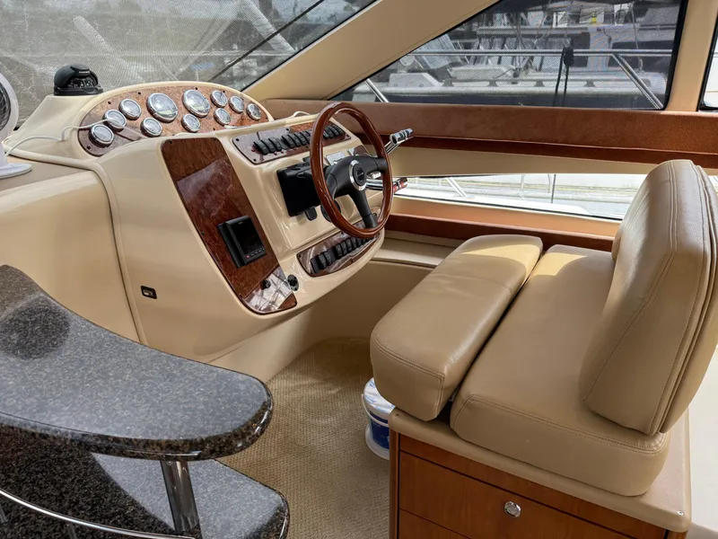 Slide: The Image of Interior of a 2006 Meridian 391 Sedan yacht with luxurious helm and seating. - 10