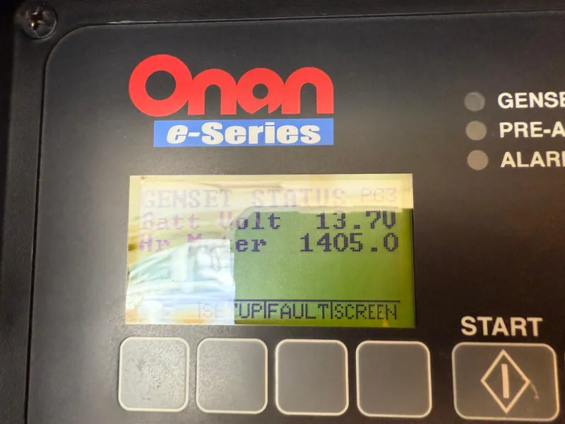 Slide: The Image of Onan e-Series generator display showing battery voltage and hours meter. - 13