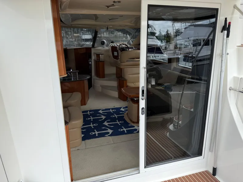 Slide: The Image of Interior view of a 2006 Meridian 391 Sedan yacht, featuring a cozy cabin and nautical decor. - 2