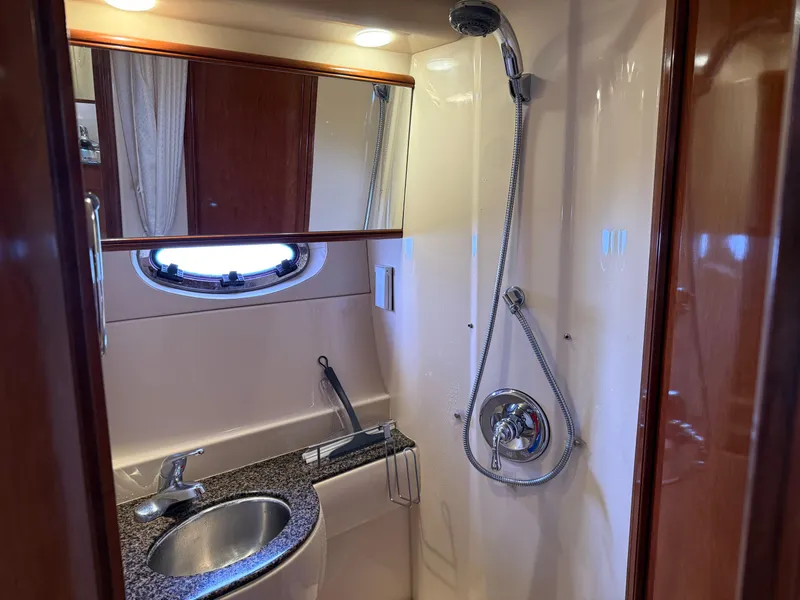 Slide: The Image of 2006 Meridian 391 Sedan yacht bathroom with shower, sink, and mirror. - 24