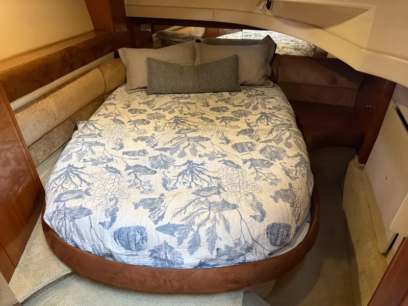Slide: The Image of Cozy bedroom in 2006 Meridian 391 Sedan yacht with floral bedding and plush pillows. - 25