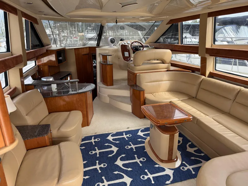 Slide: The Image of Luxurious interior of 2006 Meridian 391 Sedan yacht with leather seating and nautical decor. - 3