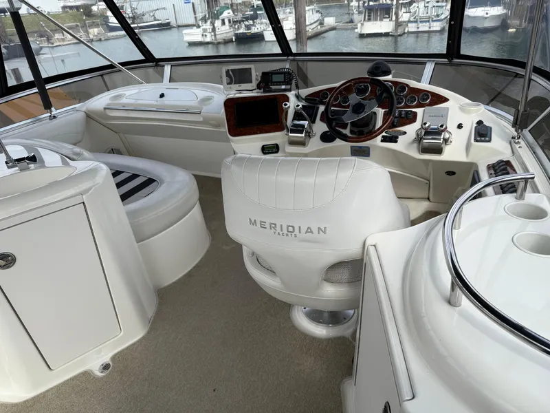 Slide: The Image of 2006 Meridian 391 Sedan yacht cockpit with steering wheel and navigation equipment. - 34