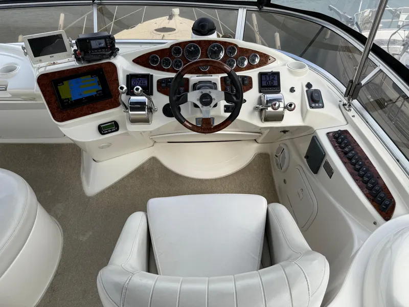 Slide: The Image of Helm of 2006 Meridian 391 Sedan with modern navigation equipment and luxurious white seating. - 35