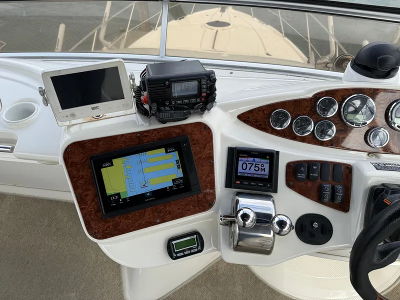 Slide: The Image of Control panel of a 2006 Meridian 391 Sedan boat with navigation and communication equipment. - 36