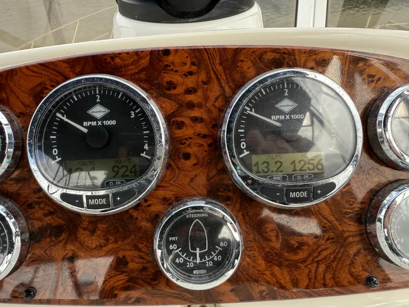 Slide: The Image of Dashboard of a 2006 Meridian 391 Sedan with RPM and steering gauges. - 38