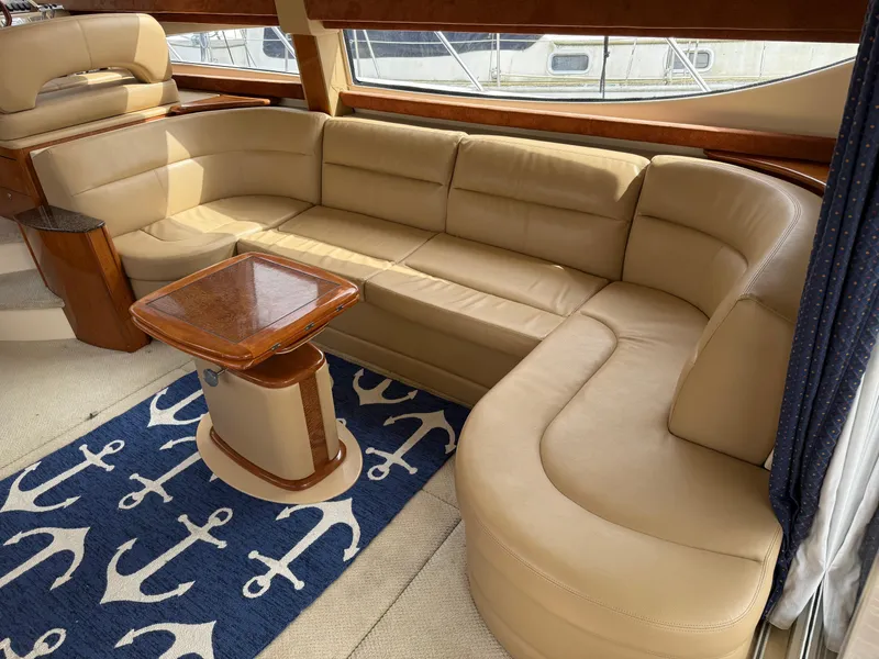 Slide: The Image of Luxurious interior of 2006 Meridian 391 Sedan with beige leather seating and nautical decor. - 4
