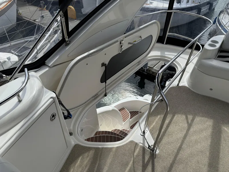 Slide: The Image of 2006 Meridian 391 Sedan yacht interior with open hatch and stairs, showcasing elegant design. - 42