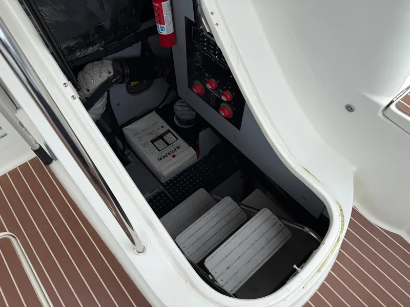 Slide: The Image of Engine compartment of a 2006 Meridian 391 Sedan with visible controls and fire extinguisher. - 45