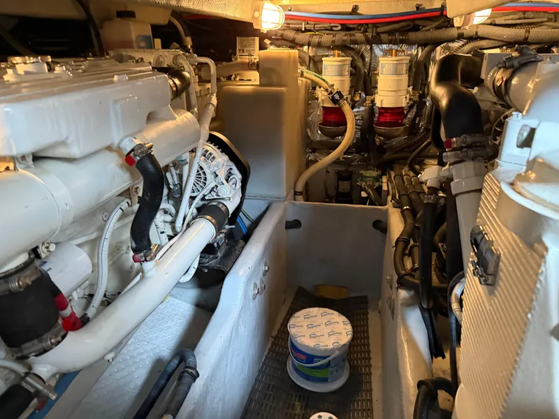 Slide: The Image of Engine room of a 2006 Meridian 391 Sedan yacht, showcasing mechanical components. - 48