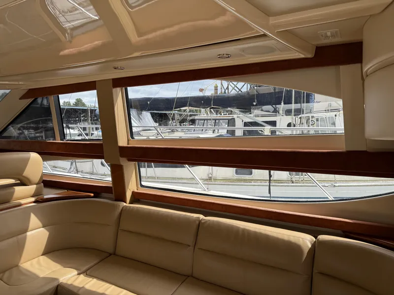 Slide: The Image of Interior view of 2006 Meridian 391 Sedan yacht with beige seating and large windows. - 5