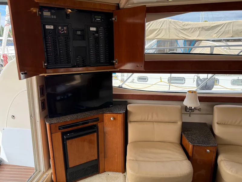 Slide: The Image of 2006 Meridian 391 Sedan interior with TV, seating, and control panel. - 7