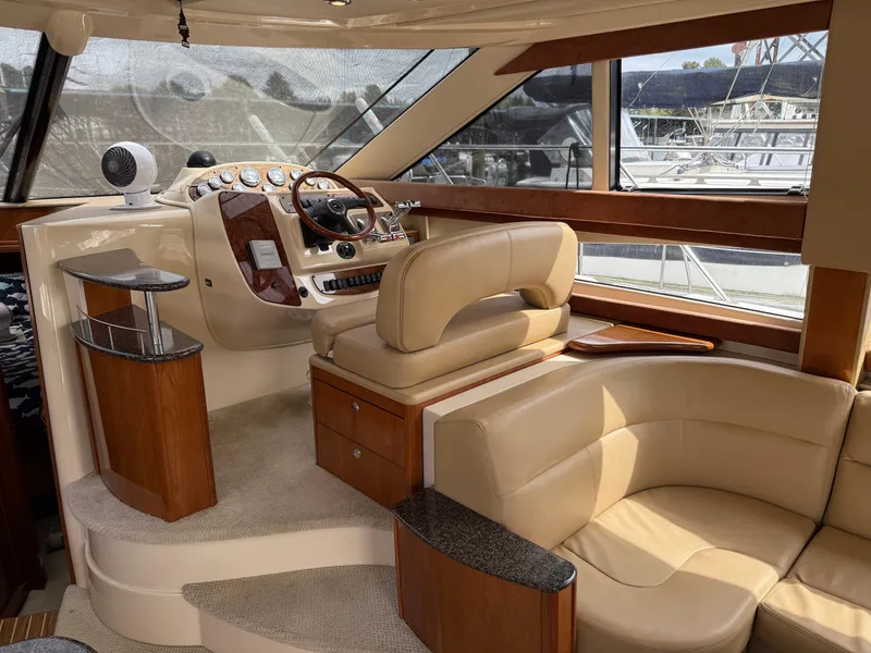 Slide: The Image of Luxurious interior of a 2006 Meridian 391 Sedan yacht with leather seating and wood accents. - 8