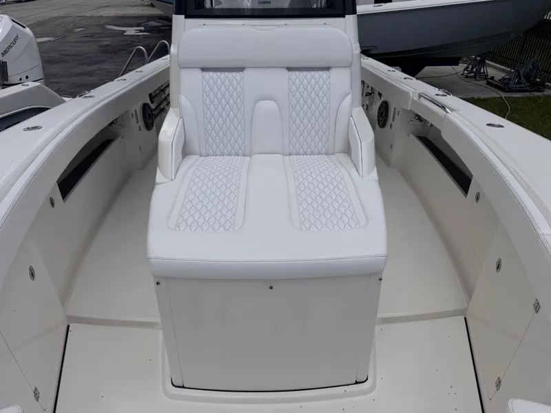 Slide: The Image of Luxurious seating on 2025 Solace 32 CS boat, featuring elegant white upholstery. - 14