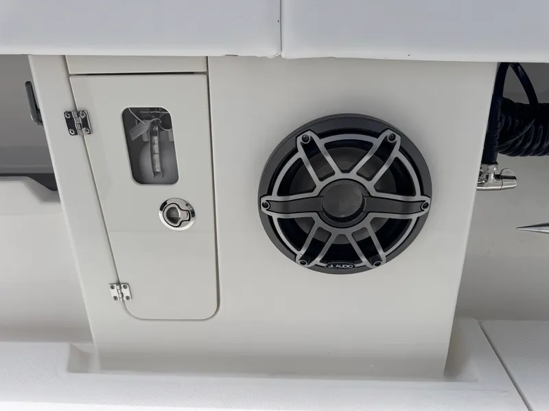Slide: The Image of Speaker and compartment on 2025 Solace 32 CS boat interior. - 17