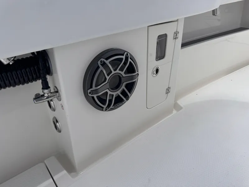 Slide: The Image of 2025 Solace 32 CS boat interior with speaker and storage compartment. - 21