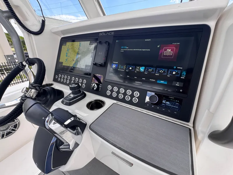 Slide: The Image of Helm of 2025 Solace 32 CS boat with advanced navigation and control systems. - 31