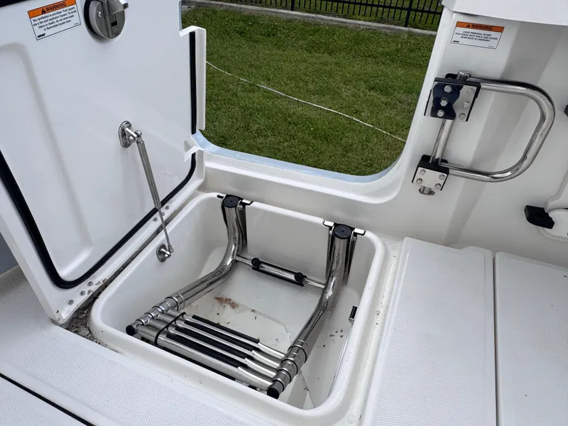 Slide: The Image of Open hatch with retractable ladder on 2025 Solace 32 CS boat deck. - 39