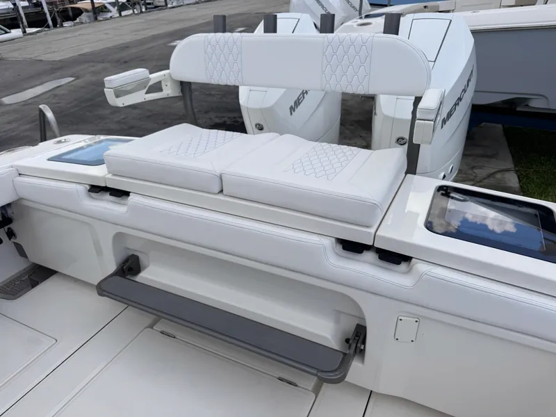Slide: The Image of 2025 Solace 32 CS boat with white cushioned seating and modern design. - 43