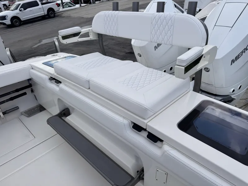 Slide: The Image of 2025 Solace 32 CS boat interior with white cushioned seating and modern design. - 44
