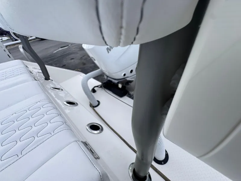Slide: The Image of 2025 Solace 32 CS boat interior with white seating and sleek design elements. - 45