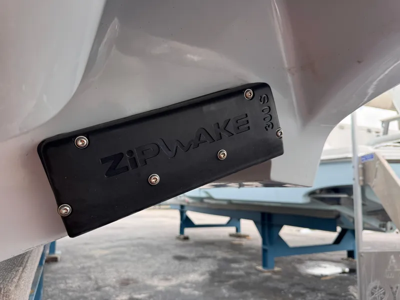 Slide: The Image of Zipwake trim system on a 2025 Solace 32 CS boat hull. - 7