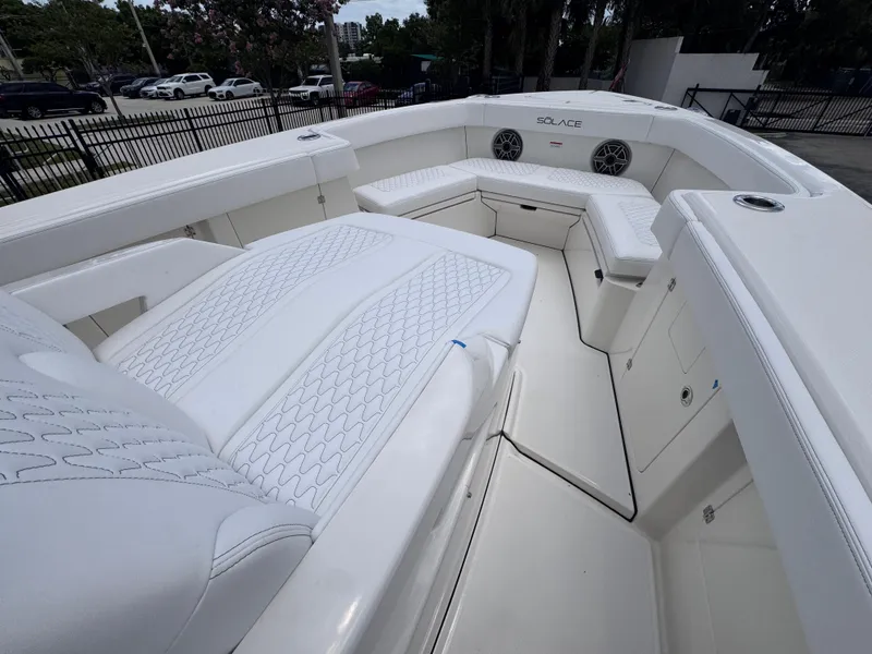 Slide: The Image of 2025 Solace 32 CS boat interior with white seating and modern design. - 8