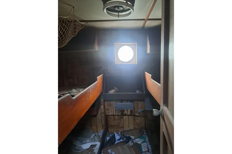 Slide: The Image of Interior of 1979 Custom Steel Trawler Dragger with bunks and porthole window. - 18