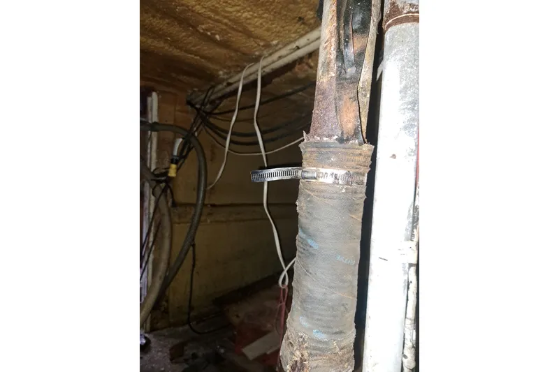 Slide: The Image of Old wiring and pipes in a 1979 Custom Steel Trawler Dragger's engine room. - 29