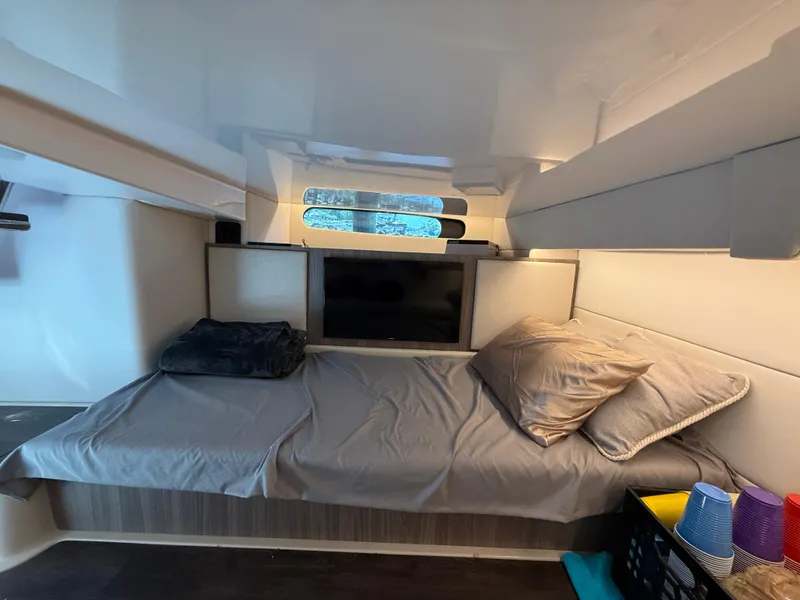 Slide: The Image of Interior cabin of 2022 Regal 36 Grande Coupe with bed and TV. - 21