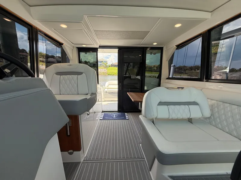 Slide: The Image of Interior of 2022 Regal 36 Grande Coupe yacht with luxurious seating and modern design. - 24
