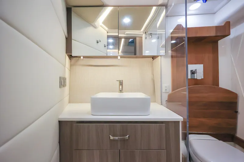 Slide: The Image of Modern bathroom interior of 2022 Regal 36 Grande Coupe yacht, featuring sleek design and fixtures. - 38