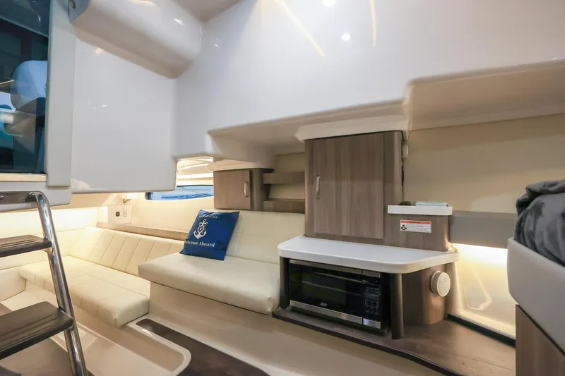 Slide: The Image of Interior of 2022 Regal 36 Grande Coupe yacht with modern seating and cabinetry. - 40