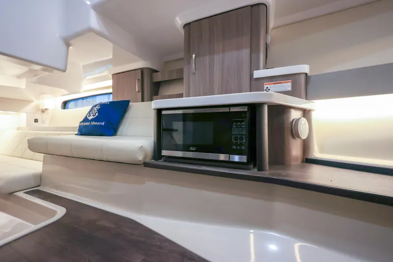 Slide: The Image of Interior of 2022 Regal 36 Grande Coupe with modern kitchen and seating area. - 41