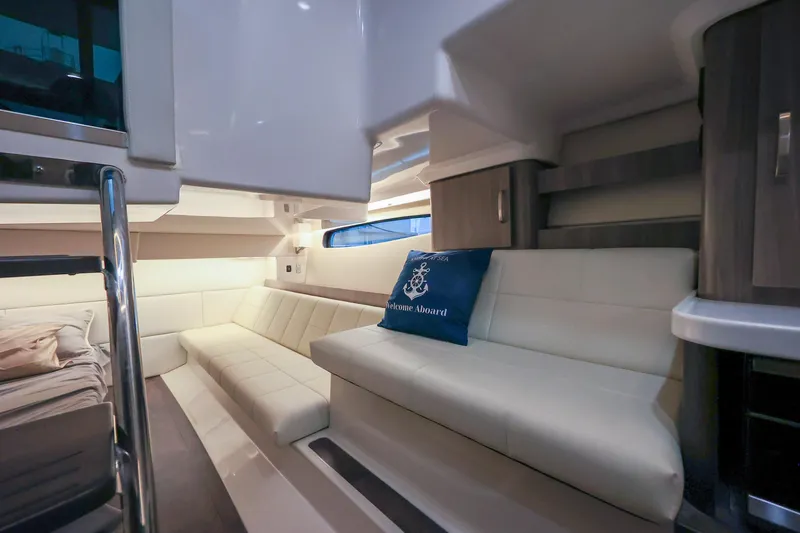 Slide: The Image of Luxurious interior of 2022 Regal 36 Grande Coupe yacht with plush seating and elegant design. - 42