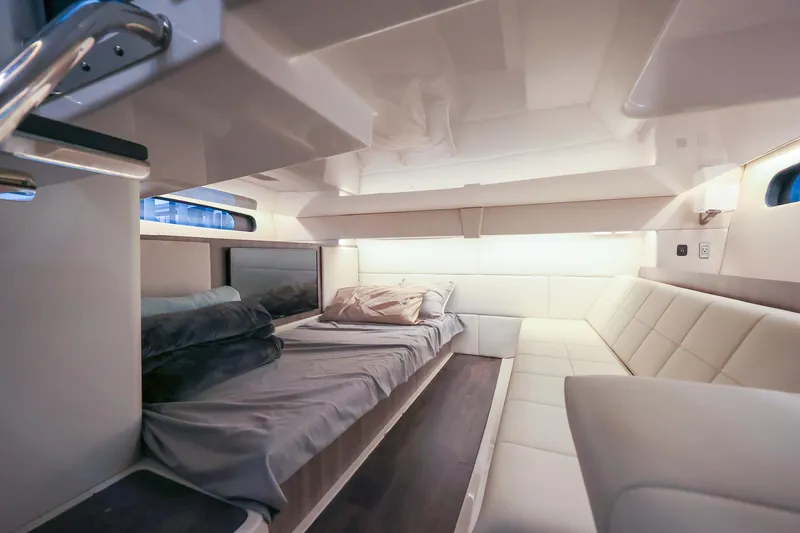 Slide: The Image of Luxurious interior of 2022 Regal 36 Grande Coupe yacht cabin with modern furnishings. - 44
