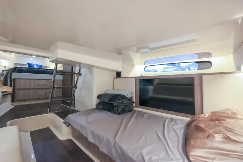 Slide: The Image of Interior of 2022 Regal 36 Grande Coupe yacht, featuring cozy sleeping area and modern design. - 45