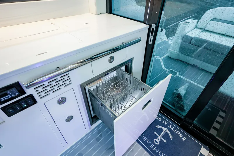 Slide: The Image of 2022 Regal 36 Grande Coupe yacht interior with open drawer and modern design. - 49