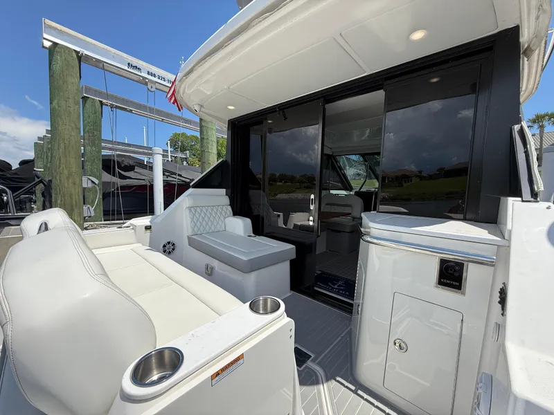 Slide: The Image of 2022 Regal 36 Grande Coupe yacht with sleek white interior and modern design. - 7