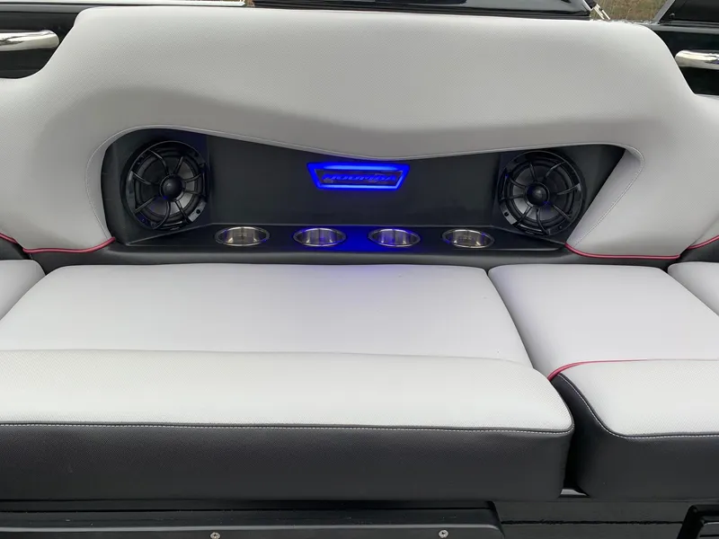 Slide: The Image of 2019 Moomba Craz boat interior with speakers, cup holders, and blue LED lighting. - 13