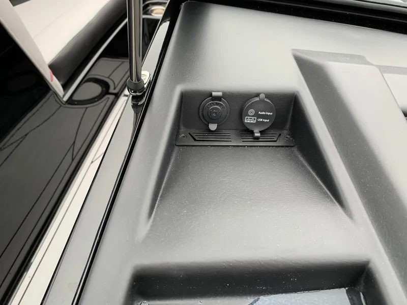 Slide: The Image of 2019 Moomba Craz boat dashboard with 12V and USB audio input ports. - 16