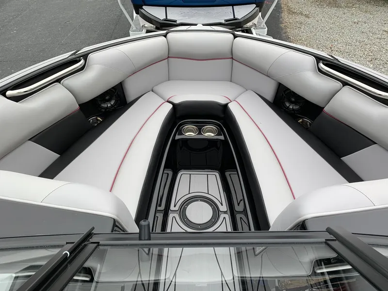 Slide: The Image of 2019 Moomba Craz boat interior with gray seating and cup holders. - 18