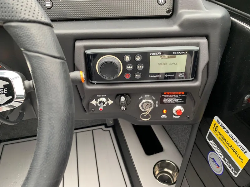 Slide: The Image of Control panel of a 2019 Moomba Craz boat with audio system and ignition switch. - 23