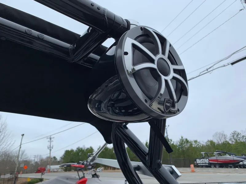 Slide: The Image of 2019 Moomba Craz boat with mounted speaker, showcasing sleek design and outdoor setting. - 24